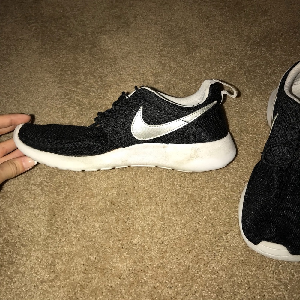 Black Nike Roshe with white swoosh